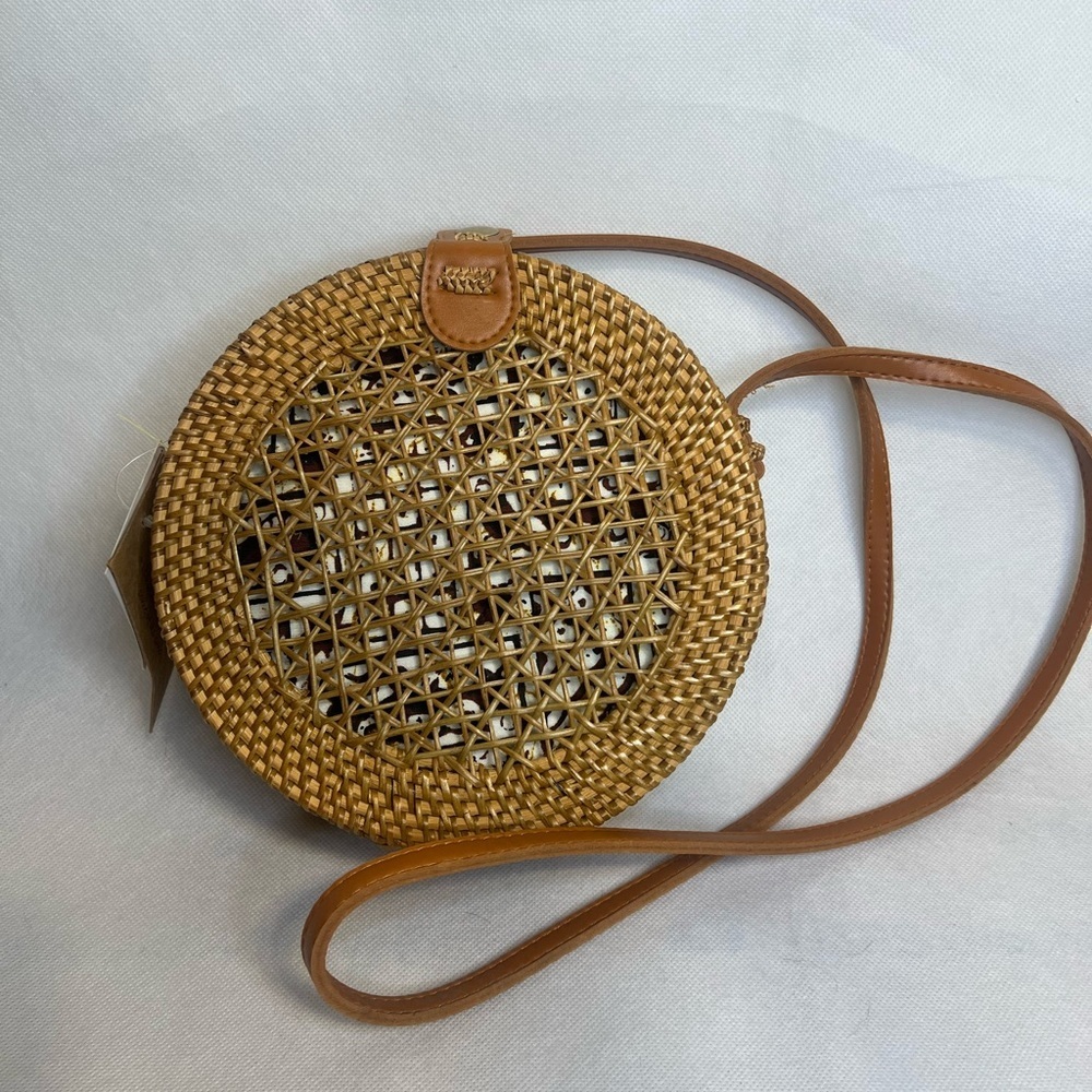 Kaari Blue round woven straw canteen crossbody bag